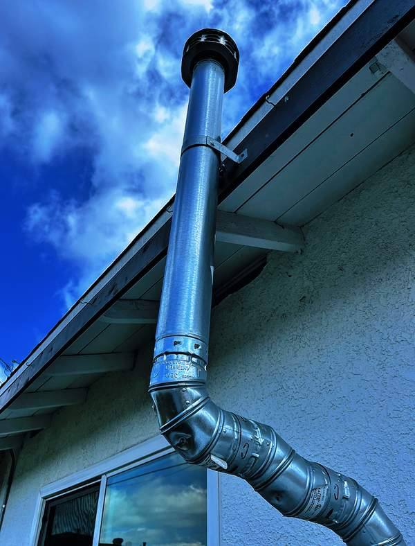 Water heater flue installed on a Pomona area home