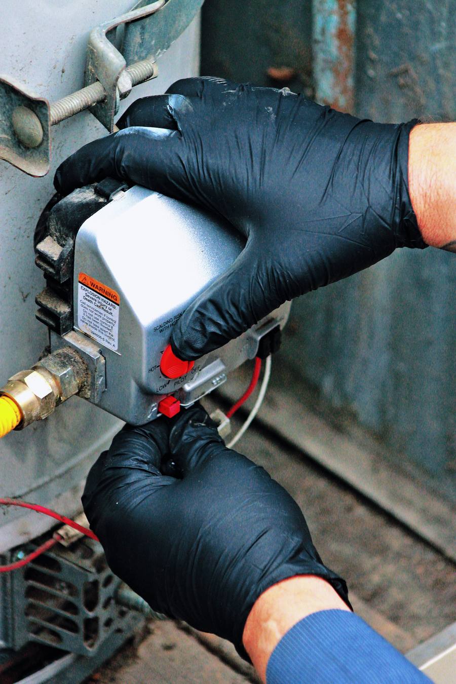 Technician working on gas line connections in Pomona, CA